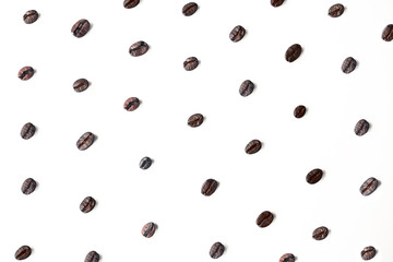 Coffee beans in blur with focuses in the middle. background for the desktop in the coffee industry, top view. dark roasted coffee.