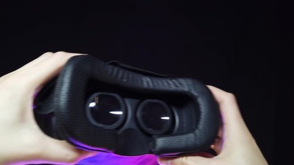 First-person view as a man puts 3D glasses on his head - Powered by Adobe