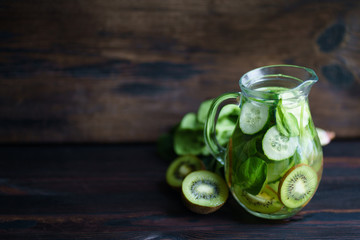 Detox drink. Infused water with kiwi and cucumber. Green lemonade, summer refreshing beverage