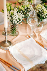 Festive table setting for the wedding venue.