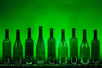 abstract empty wine bottles with green led illumination