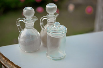 A transparent glass vase for holding a sand wedding ceremony.