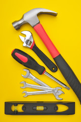Group of tools on yellow background