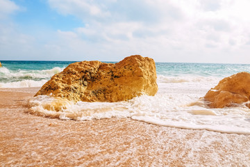 cliffs on the famous Benagill beach in Portugal, waves crashing on cliffs, the raging ocean.
