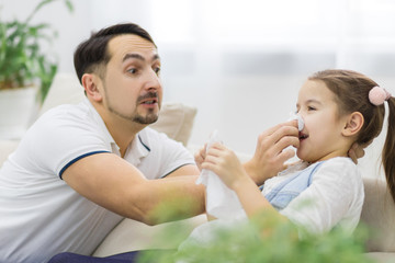 Father is helping his little daughter. Laughinh out loud