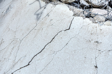 Destroyed concrete slab with many cracks.