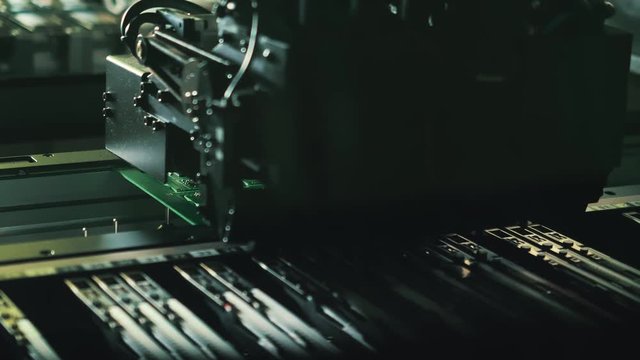 Robotic chip manufacturing. Automatic electronic soldering of microchips. Close-up.