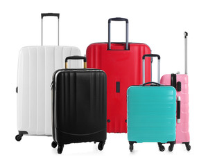 Set of different stylish suitcases for travelling on white background