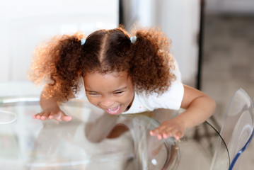 Young cute little girl gesturing with her mouth.