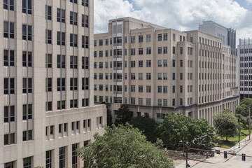 Obraz na płótnie Canvas Generic office buildings in plain downtown settings on cloudy day
