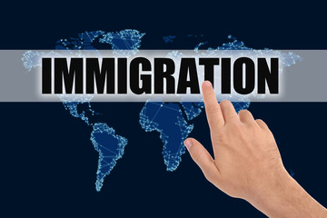 Man pointing at word IMMIGRATION and world map on dark blue background, closeup