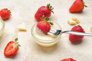 Tasty strawberry with melted chocolate on grey background