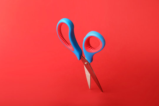 Scissors for paper on color background