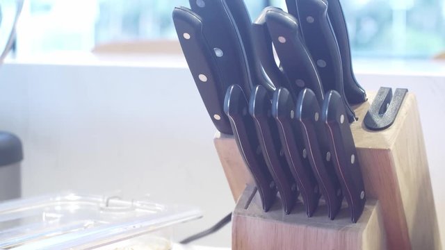 Food worker pulls out knife to cook burritos in restaurant caf&eacute;