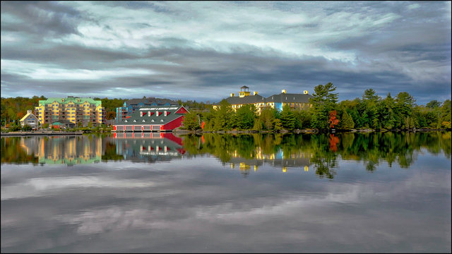 Gravenhurst, Ontario / Canada - 10/05/2008: water reflection of the buildings in the waterfront in Gravenhurst, Ontario, Canada.