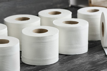 Rolls of toilet paper on wooden background