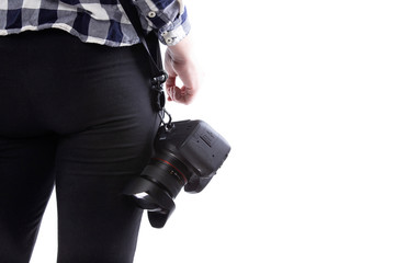 Close up view of unbranded lens and camera carried by a self-employed female gig photographer or...