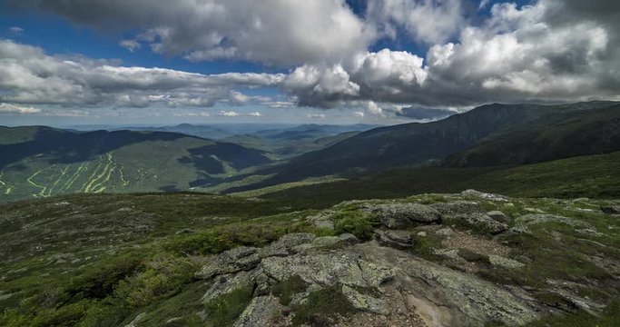 Time-lapse on Mount Washington, New Hampshire, with an amazing mountainous landscape and fluffy clouds. Includes 2 versions, one with a digital pan using full image res and one stationary.
