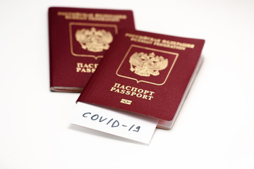 Coronavirus COVID-19 and tourism. Passport, COVID-19 inscription for travel. Quarantine. Restriction for tourists. Covid19 Corona virus disease danger pandemic spread worldwide global