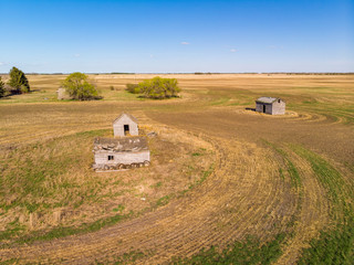 aerial views of old farm houses, barns and other buildings that were built by some of the earliest farming settlers of the Saskatchewan Prairies. These buildings date back to the early 1900's