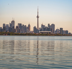 Panoramic view of Toronto skyline over the Ontario Lake during the golden hour, Canada
