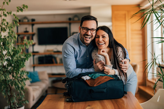 Portrait Of A Happy Couple, Packing For Vacation.