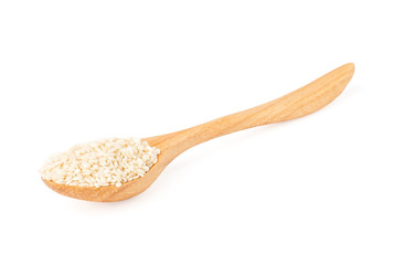 Wooden spoon with white sesame isolated on white background.