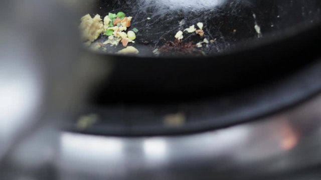 Flipping food in pan & blue flames