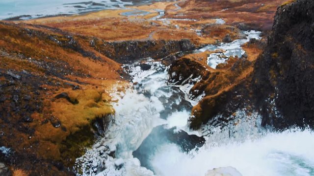 Looking over edge of waterfall Dynjandifoss in Iceland, Westfjords