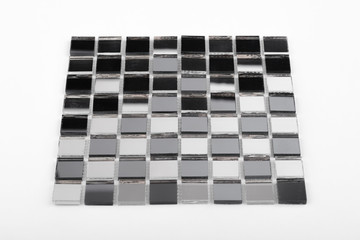 Glass and mirror mosaic without reflections isolated on a white background. For construction and repair in the bathroom, pool, kitchen.