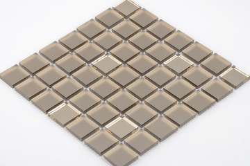 Glass and mirror mosaic without reflections isolated on a white background. For construction and repair in the bathroom, pool, kitchen.
