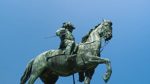 Low angle circling footage of bronze statue of Archduke Albert in Vienna