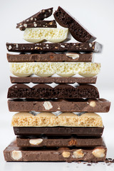 Different kinds of chocolates with nuts cocoa powder and mint