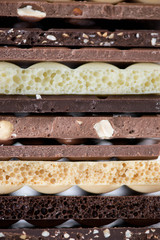 Different kinds of chocolates with nuts cocoa powder and mint