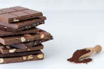 Different kinds of chocolates with nuts cocoa powder and mint