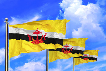 Brunei National Flags Waving In The Wind On A Beautiful Summer Blue Sky