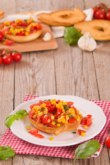 Friselle with tomatoes and mais.
