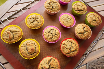 Set of freshly baked homemade cupcakes on tray. High angle shot. Cooking at home or dessert concept