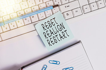 Writing note showing Reset Realign Restart. Business concept for Life audit will help you put...