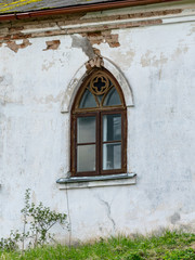 arched windows on a white church wall