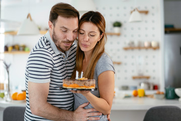 Husband's birthday.Wife surprise his husband with birthday cake