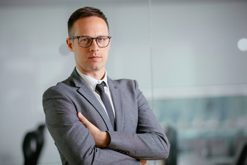 Fototapeta premium Portrait of handsome businessman working in office.