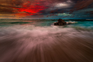 Slow motion the waves under the sunset 