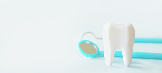 White human tooth with dentist tools set such as mirrow, claner.