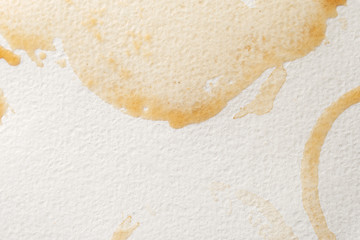 Abstract liquid drops splash brown coffee on a white texture paper background for watercolor. Artistic decoration or backdrop. Banner for text, grunge element.