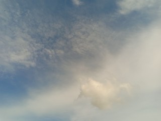 black and white clouds with blue sky