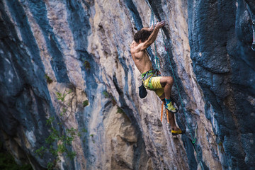 A strong man climbs a rock, Rock climbing in Turkey.