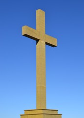 Cross on the hill with blue sky background