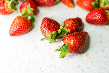 Freshly picked strawberries from the home garden. Natural organic food production. Heap of summer red berries. Homegrown, gardening and agriculture concept. Close up. Soft focus