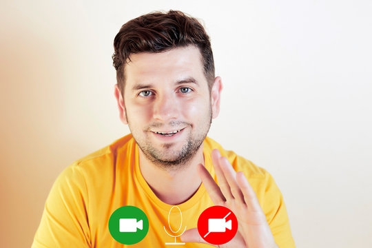 Caucasian man smiling and waving on a video call